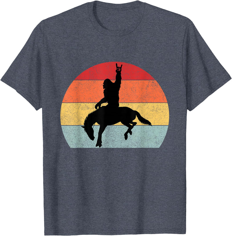 Bigfoot Rodeo Gear Bigfoot Riding a Horse Rodeo Retro Sunset Funny T-Shirt - Heather Blue